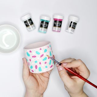 painting plant pot with multicolours
