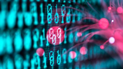 Red glowing fiber optic cables touching a screen with computer source code and highlighting code snippet in red. 