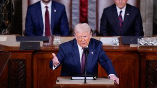 President Donald J Trump addresses a joint session of Congress as Vice President JD Vance and Speaker of the House Mike Johnson (R-LA) listen in the Capitol building's House chamber on Tuesday, March 04, 2025 in Washington, DC. 