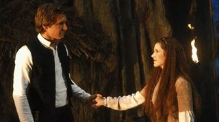 Han and Leia hold hands in a scene from "Star Wars: Return of the Jedi"