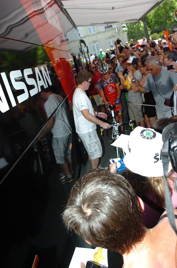 Armstrong makes his way past the crowds of fans.