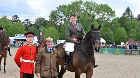 Red Valentine II and WIll Morton smile and stand for the camera as they are presented their trophy for the 2026 Windsor small hunter title
