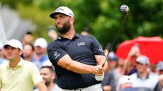 Jon Rahm hits a tee shot