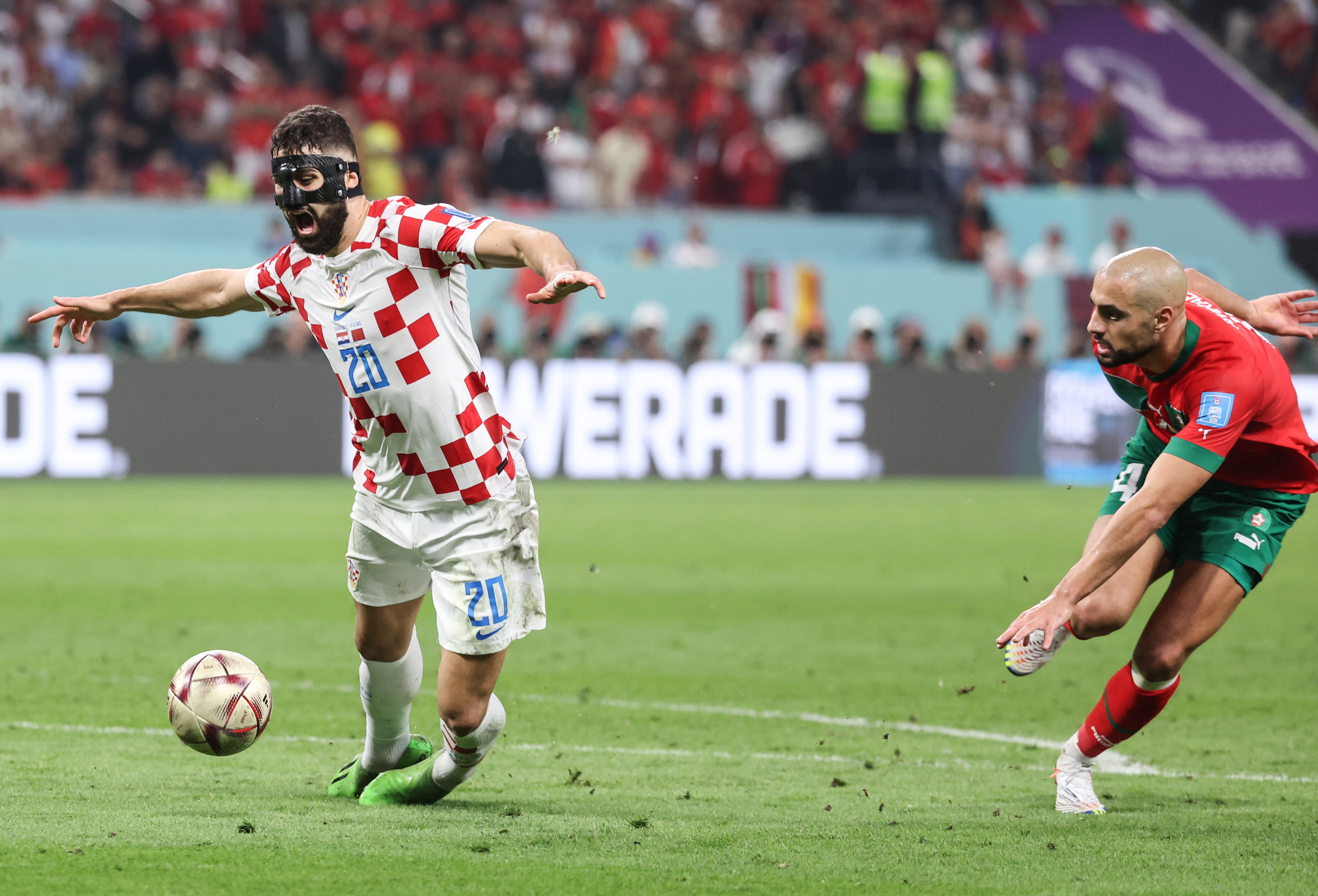 Croatia's Josko Gvardiol goes down in the area after a challenge from Morocco's Sofyan Amrabat in the 2022 World Cup play-offs for third place.