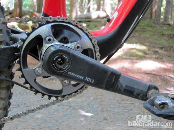 The new SRAM XX1 crankset is lighter than XX by virtue of having just one chainring but the arms themselves are actually bigger and heavier. Note the asymmetrical bolt circle pattern, too, which allows the chainring to slide out around the crankarm for easier ratio changes while also virtually guaranteeing that it can't be improperly installed.