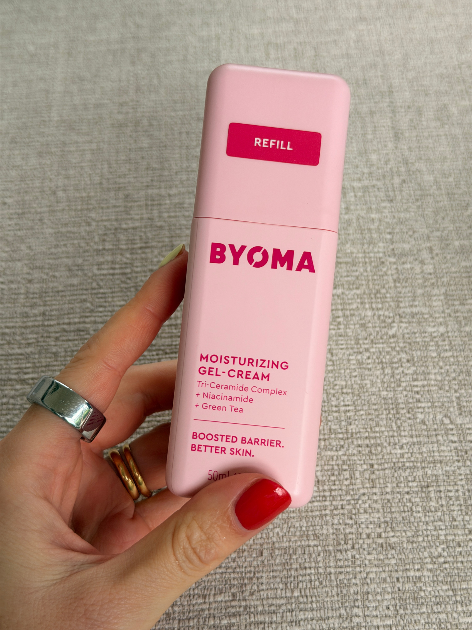 Freelance beauty editor Grace Day holding the Byoma moisturiser