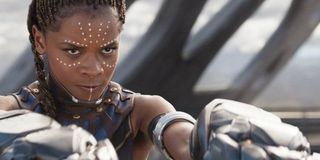 Black Panther Shuri standing with her gauntlets ready to fire