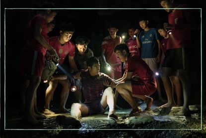 Members of a youth soccer team trapped in a cave in Netflix's Thai Cave Rescue