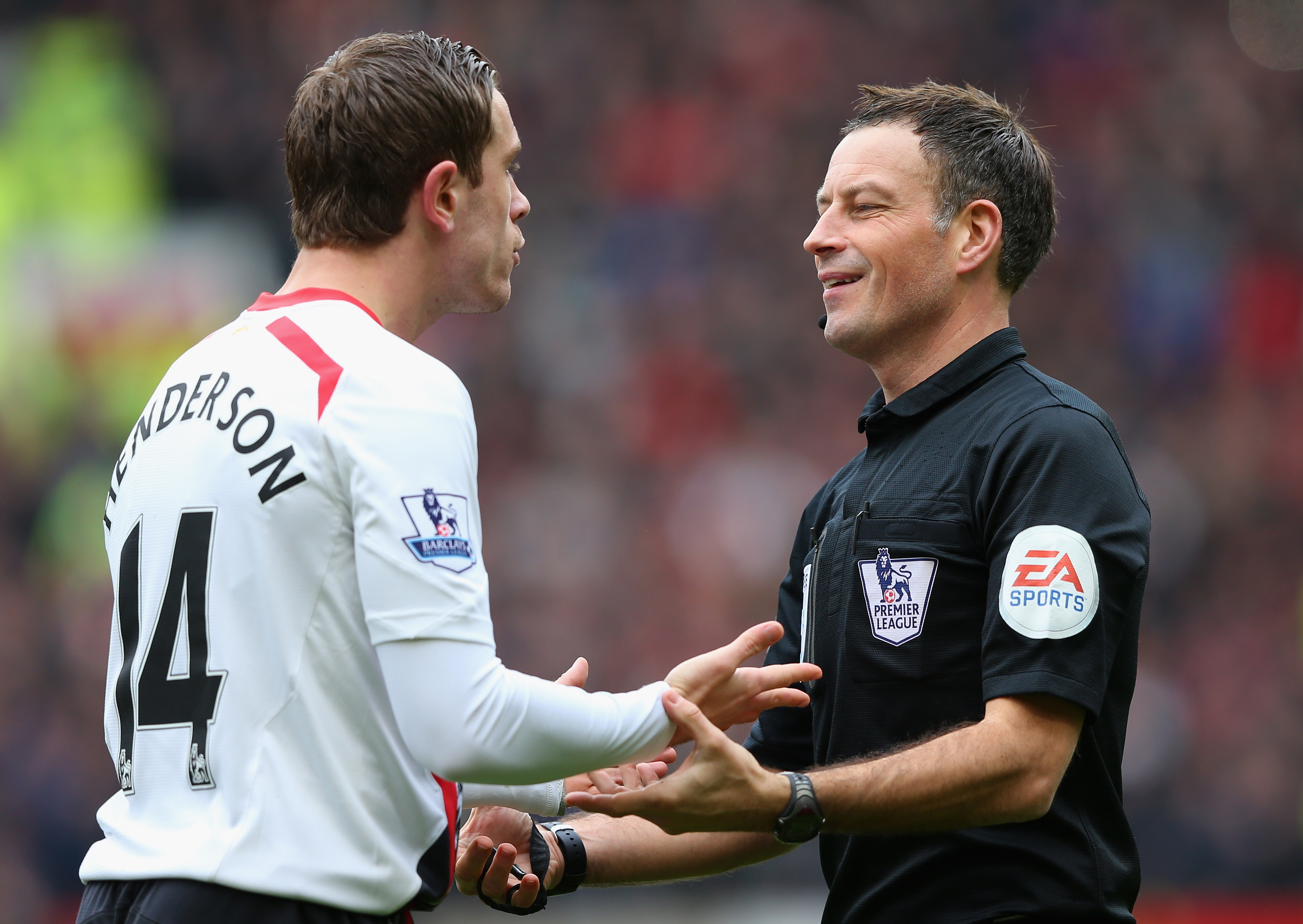 Mark Clattenburg and Jordan Henderson have a heated discussion
