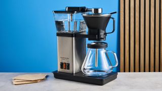 the simply good coffee plastic-free brewer photographed against the blue tom's guide backgrounds