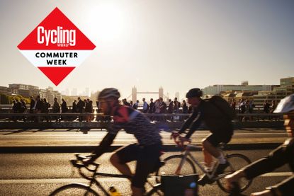 Cycle commuters in London, with Tower Bridge in the background