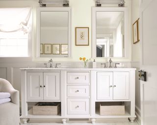 White bathroom cabinetry and mirrors by Benjamin Moore