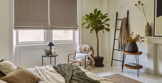 neutral bedroom with taupe boucle fabric blinds for comfort to support key interior design trends 2023