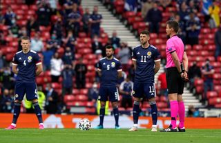 Scotland's players have been standing against racism before kick-off.