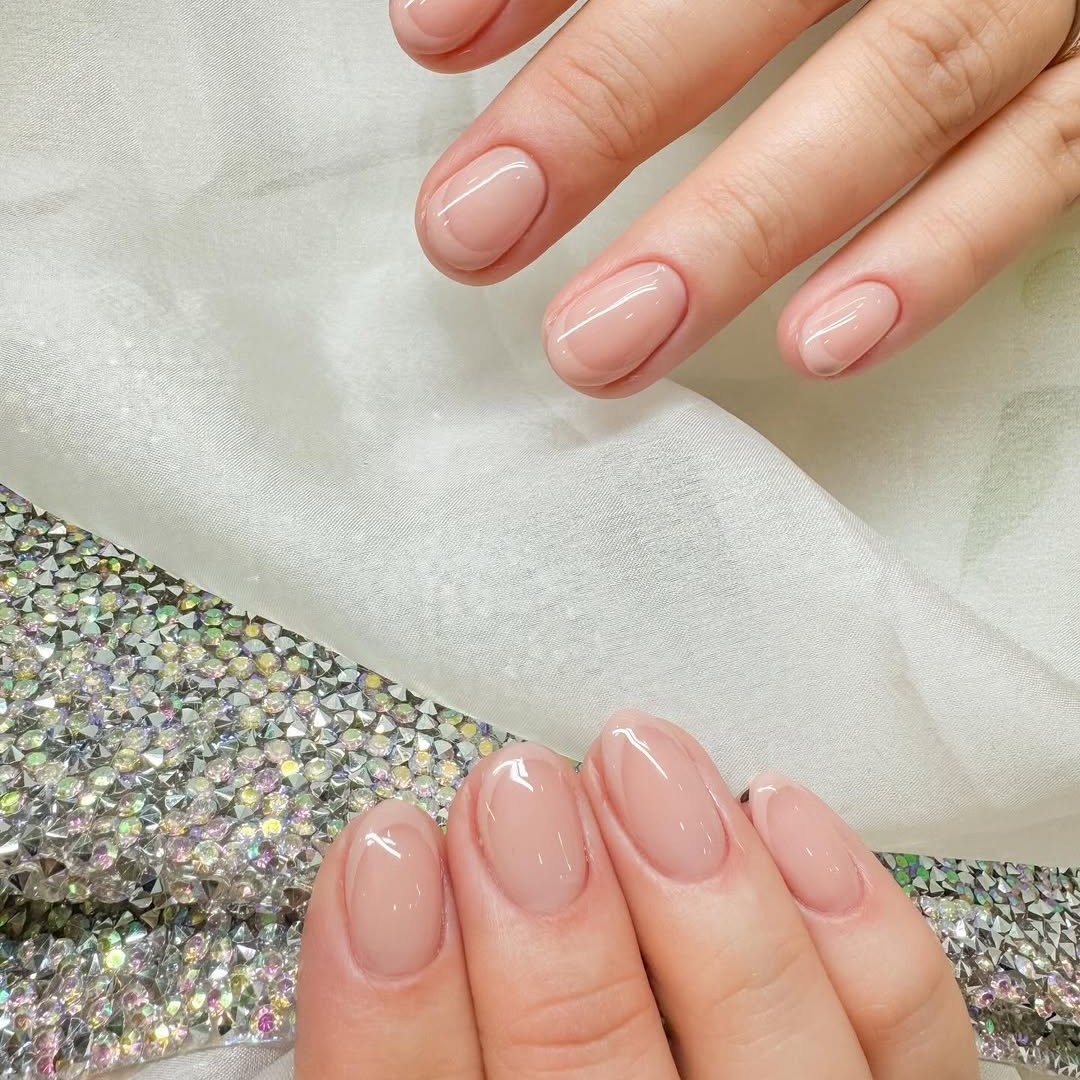 A French manicure with sheer nude tips.