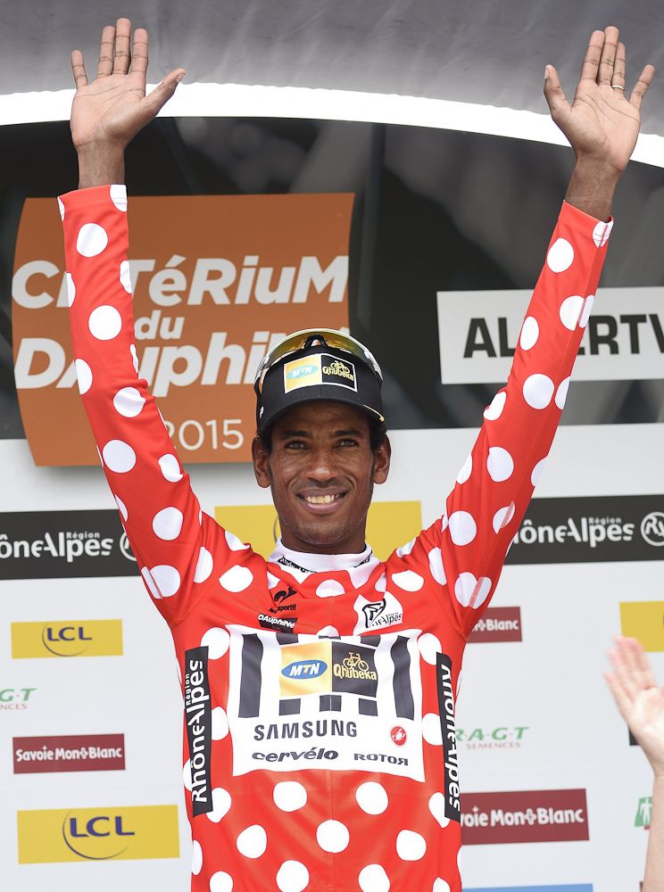 Eritrea's Daniel Telehaimanot (MTN-Qhubeka) celebrates his best climber's polka dot jersey at the end of the 131.5 km first stage of the 67th edition of the Criterium du Dauphine.