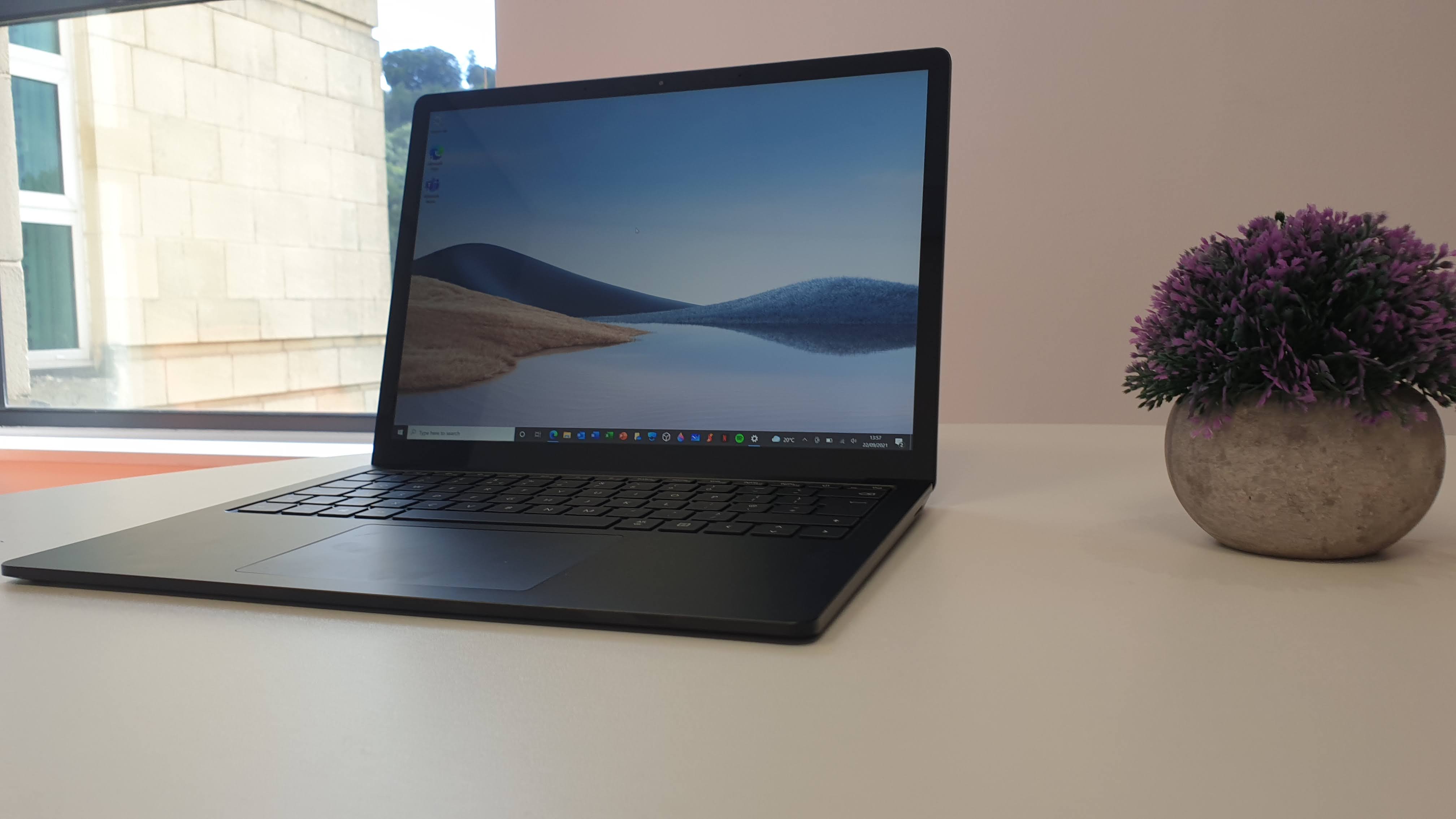 Surface Laptop 4 on a wooden table in a desk