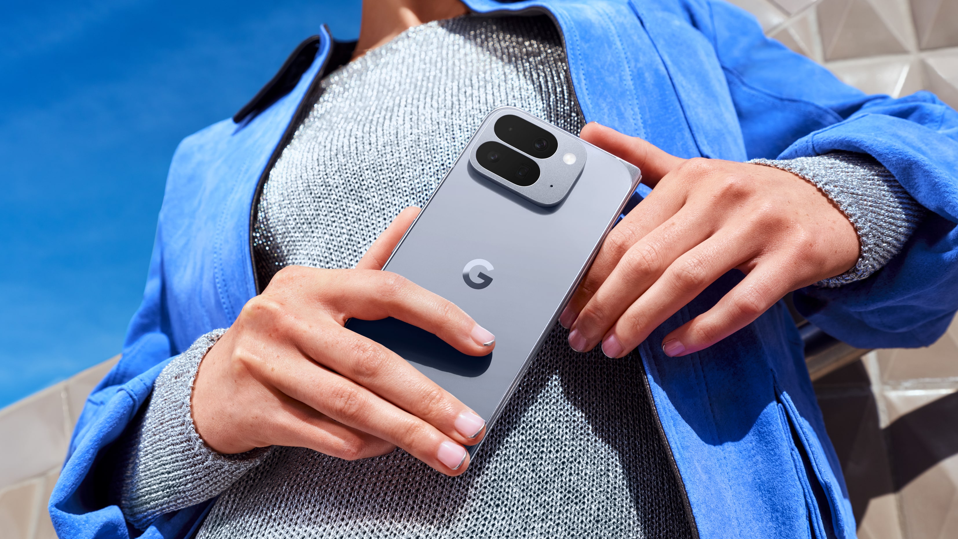 A woman holding the Google Pixel 10 Pro Fold
