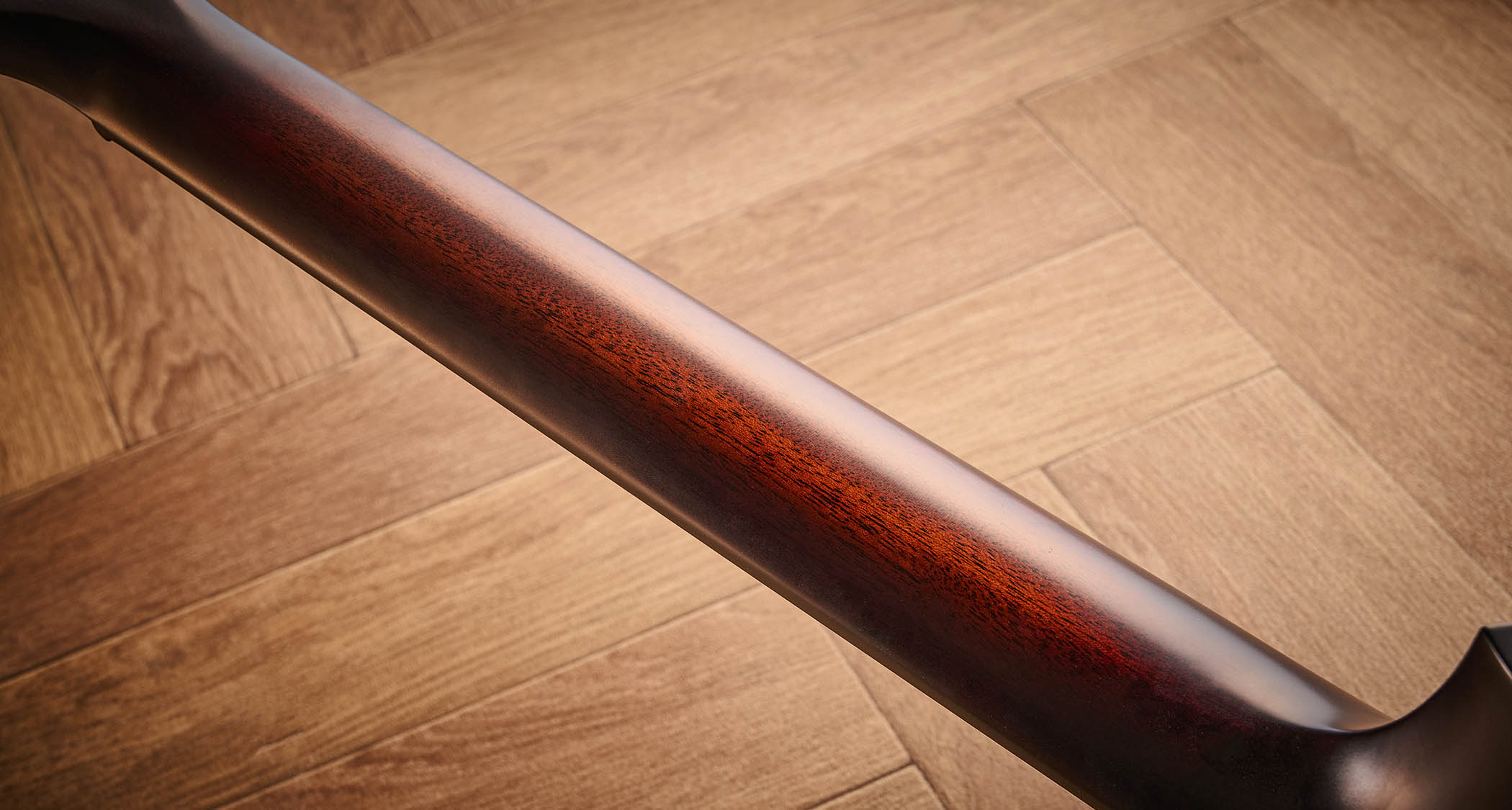 Taylor Builder’s Edition 514ce Kona Burst pictured against a wooden floor and patterned rug.