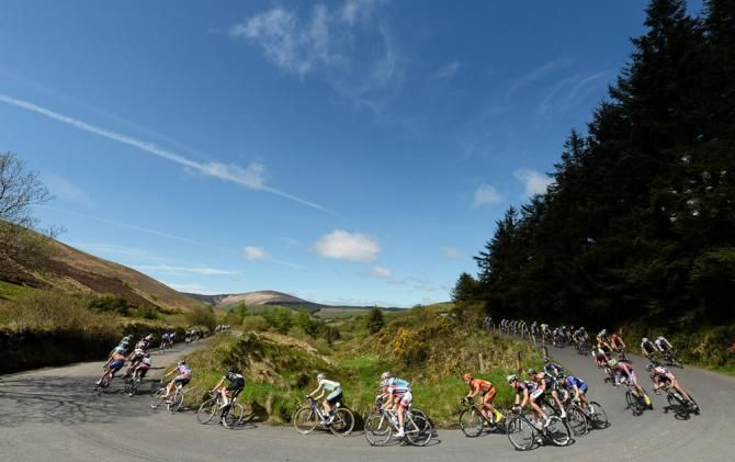 The An Post Ras peloton negotiates a turn in Curenney during stage 3