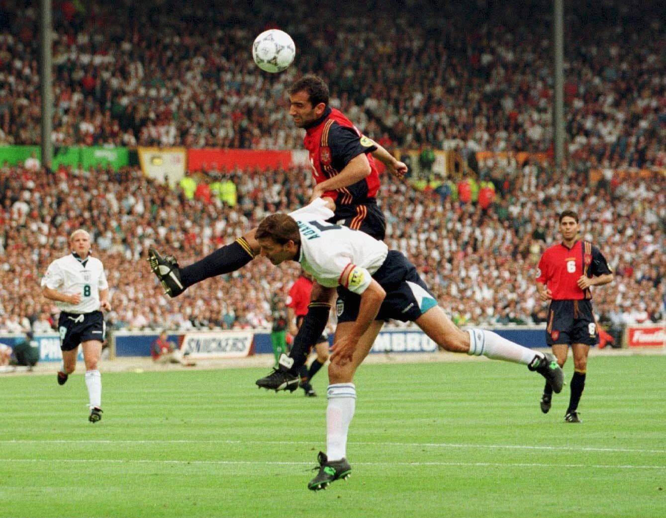 Spain's Abelardo beats England's Tony Adams to a header at Euro 96.