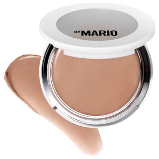 MAKEUP BY MARIO Softsculpt Transforming Skin Enhancer Bronzer in front of a makeup swatch