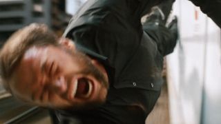Hugh Jackman hanging on for dear life in The Wolverine