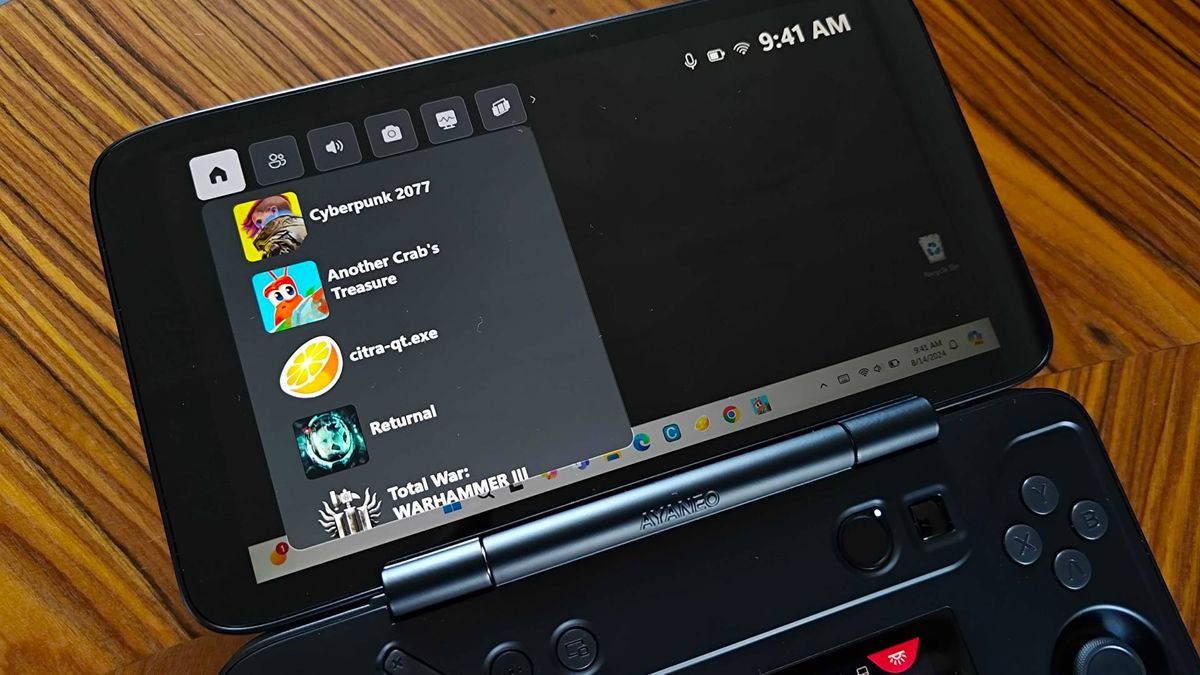 Close up of Ayaneo Flip DS with Xbox Game Bar compact mode with recent games menu including Another Crab's Treasure, Cyberpunk 2077, Citra, Returnal, and Total War: Warhammer 3