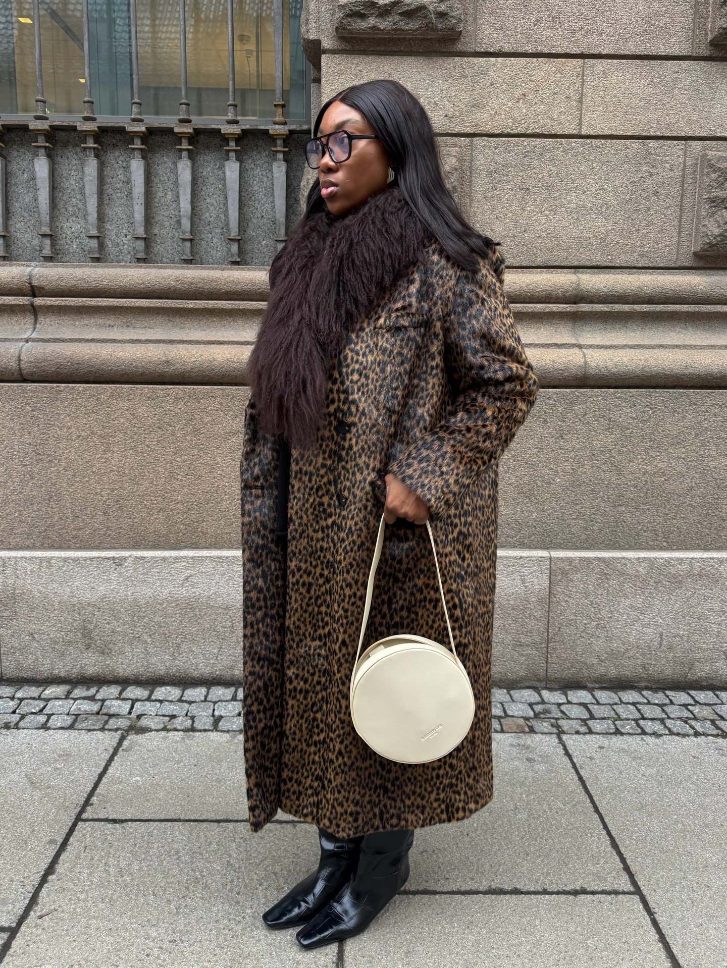 An image of @nnennaechem wearing a leopard-print coat, one of the biggest animal print trends of 2026.