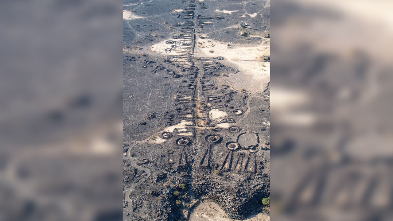 Here, part of a funerary avenue in Saudi Arabia, flanked by pendant-shaped stone tombs.