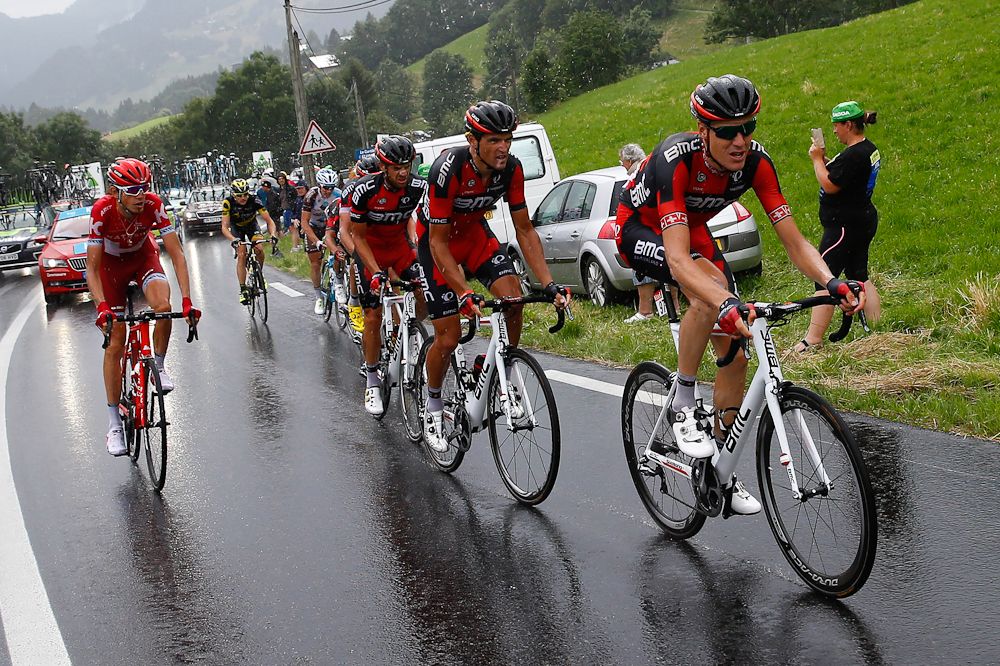 BMC riders lead Richie Porte back to the yellow jersey group after he crashed.
