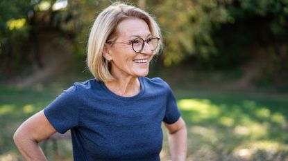 Woman smiling after doing Penn State 4-minute workout