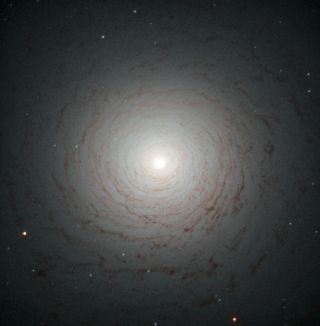 The galaxy NGC 524 is a lenticular galaxy with an intricate spiral shape, which was imaged in a photo released July 22, 2013 by the Hubble Space Telescope.