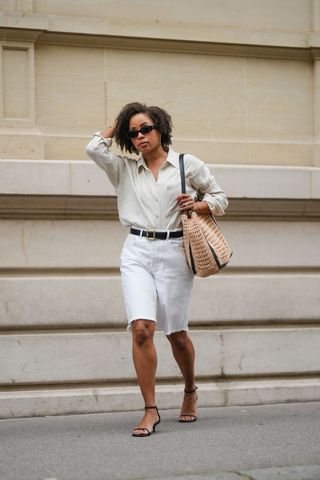 woman wearing white top and white Bermuda shorts