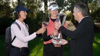 Kay Cockerill working for the Golf Channel as Nelly Korda receives the trophy for her T-Mobile Match Play win