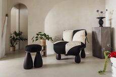 Chunky-looking furniture items including armchairs, chairs, stools, coffee tables, and sofas boast an organic feel and pleasing surface against a cream background.