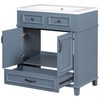 A blue under sink cabinet with three drawers and one large cupboard