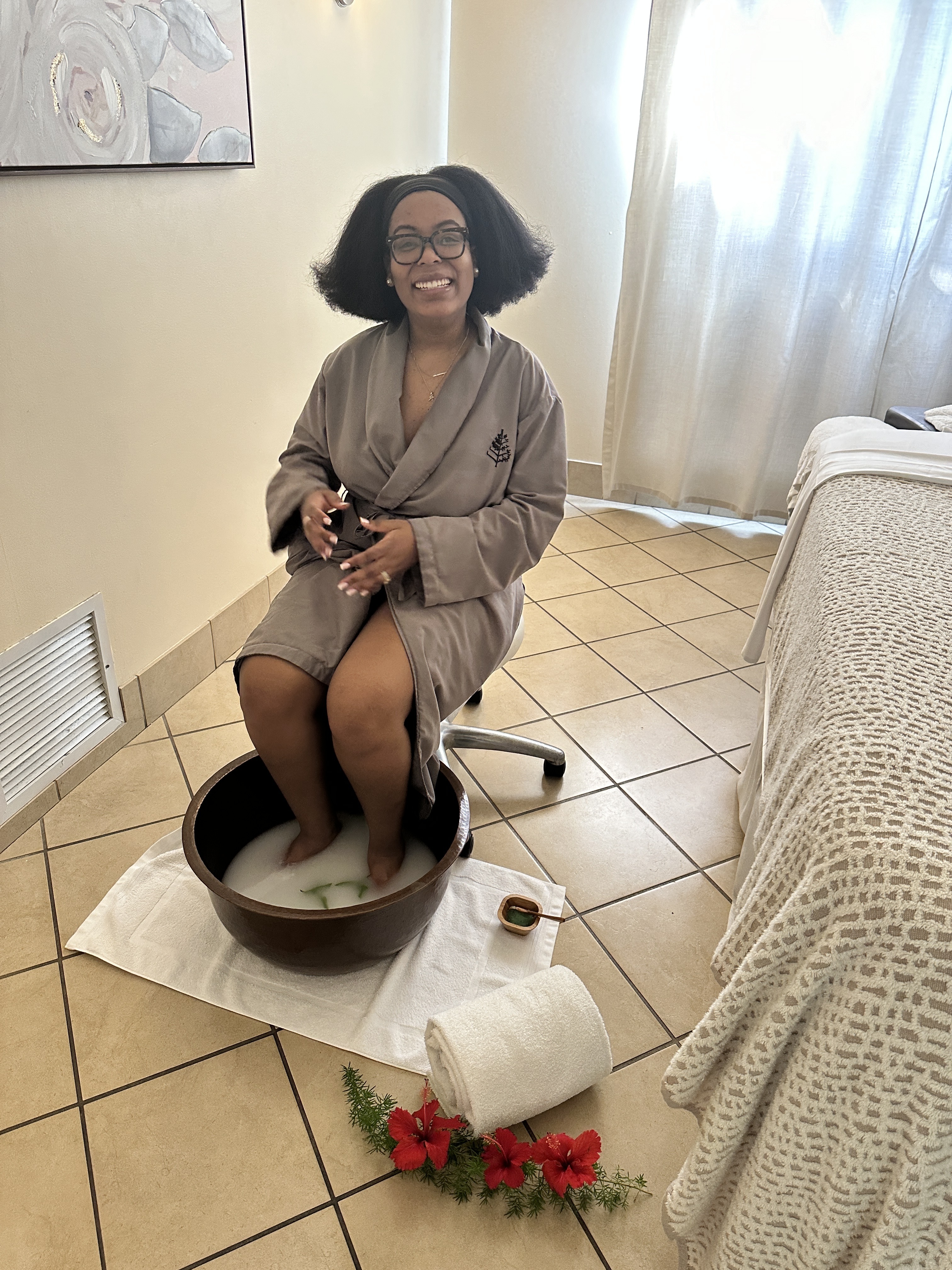 Ariel Baker at the four seasons nevis spa with her feet in water.