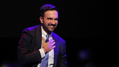 Zohran Mamdani puts his hand on his heart as he celebrates his mayoral race victory an election night event at the Brooklyn Paramount Theater in New York City
