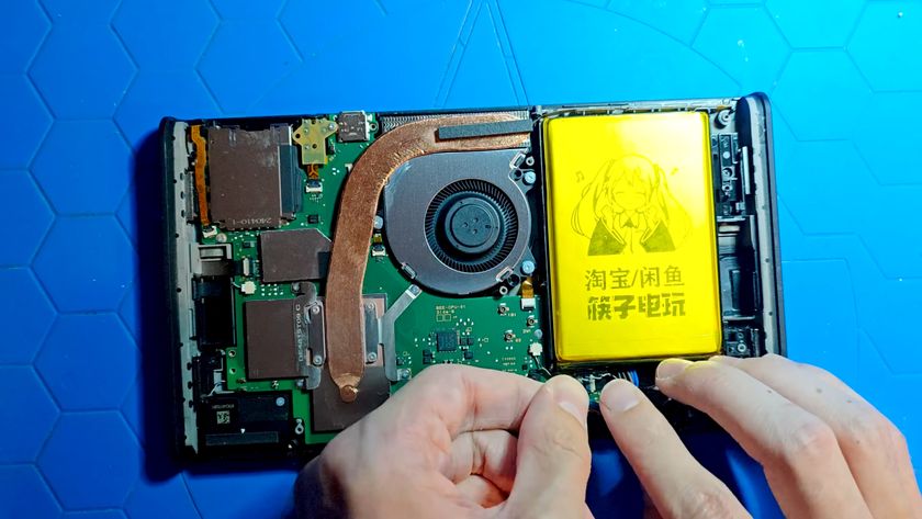 A third party 8000 mAh battery unit being installed inside the Nintendo Switch 2