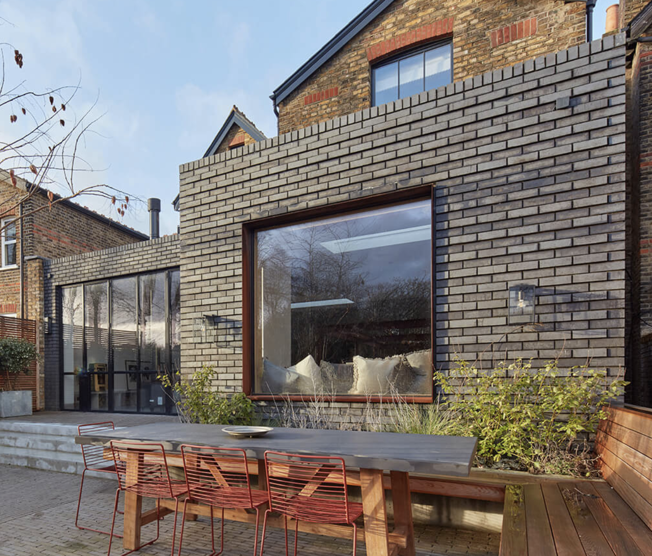 modern blue brick extension with picture window