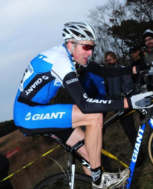 Carl Decker (Team Giant) climbing into the woods
