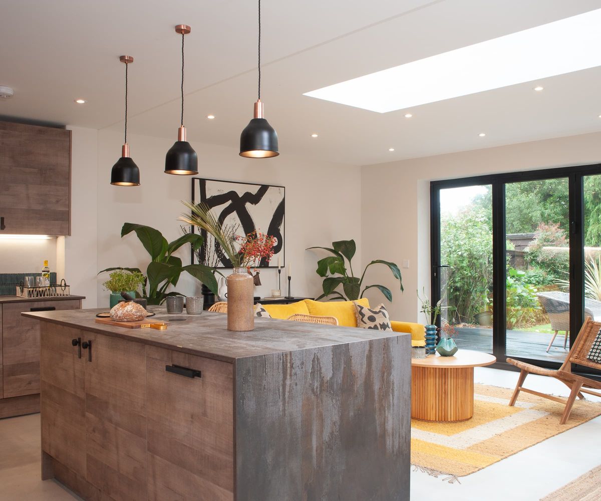 A kitchen-diner with a skylight and bifold doors leading onto the garden