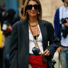 a woman wearing jewelry in street style