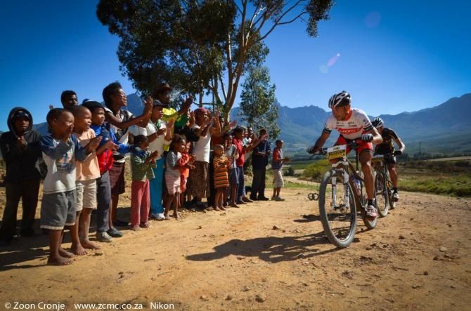 Jacques Rossouw leads Waylon Woolcock past some local spectators