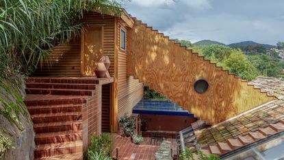house in mexico by pedro y juana, featuring timber annex with a staircase like shape