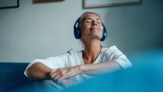 blonde woman with a pair of headphones in