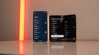 A Google Pixel 8 Pro and Google Pixel Fold using Android 15's dark mode