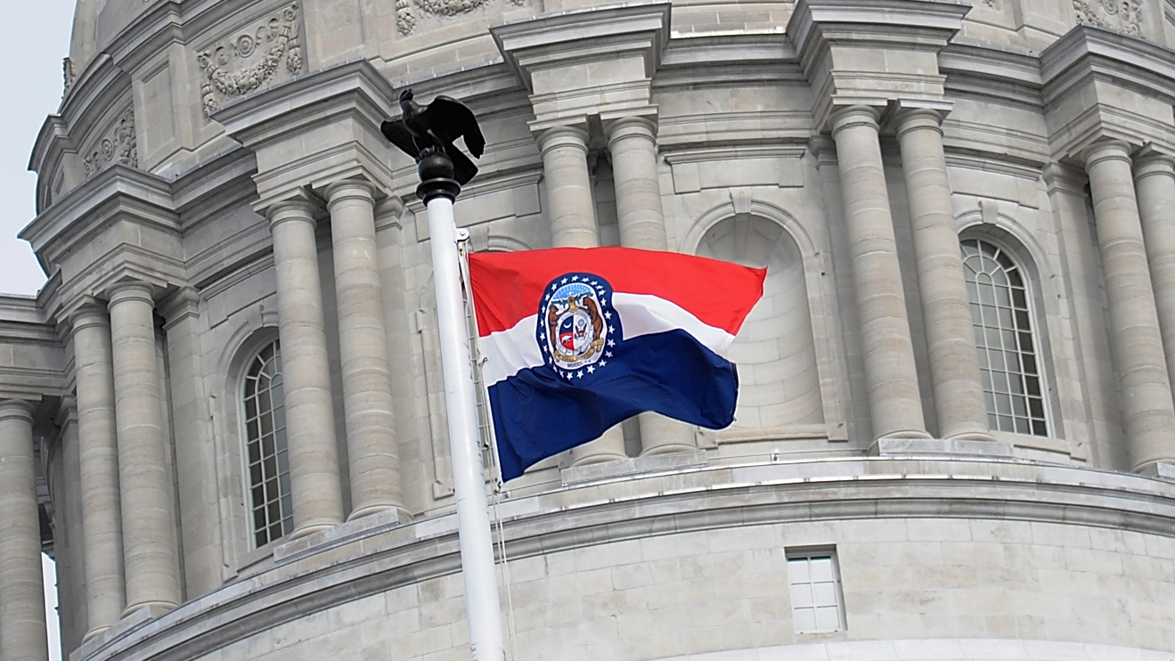 State flag of Missouri outside the state&#039;s capital building