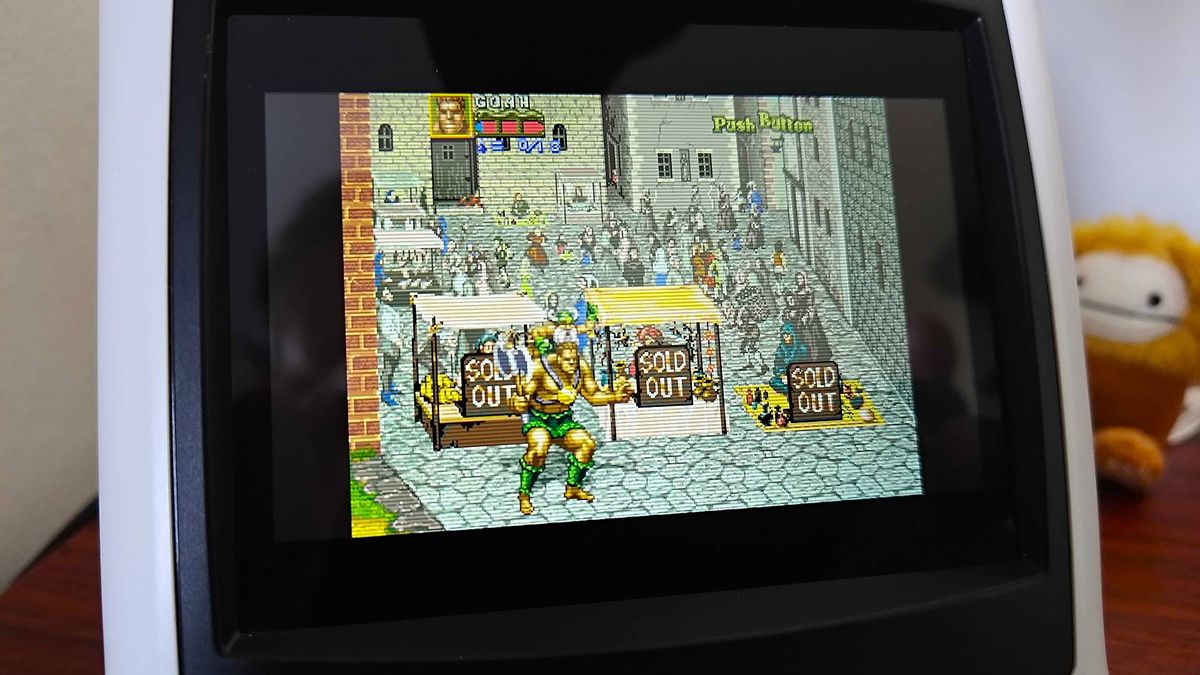 Close up of Sega Astro City Mini screen with Golden Axe: The Revenge of Death Adder gameplay on screen.